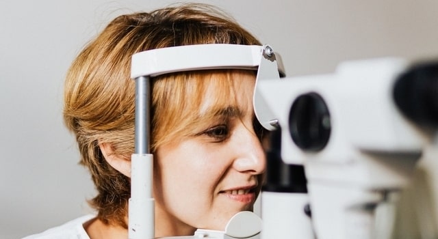 middle aged woman at an eye exam